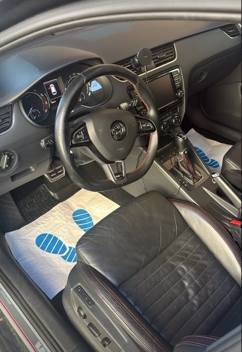 Interior of a Volkswagen car with blue protective coverings